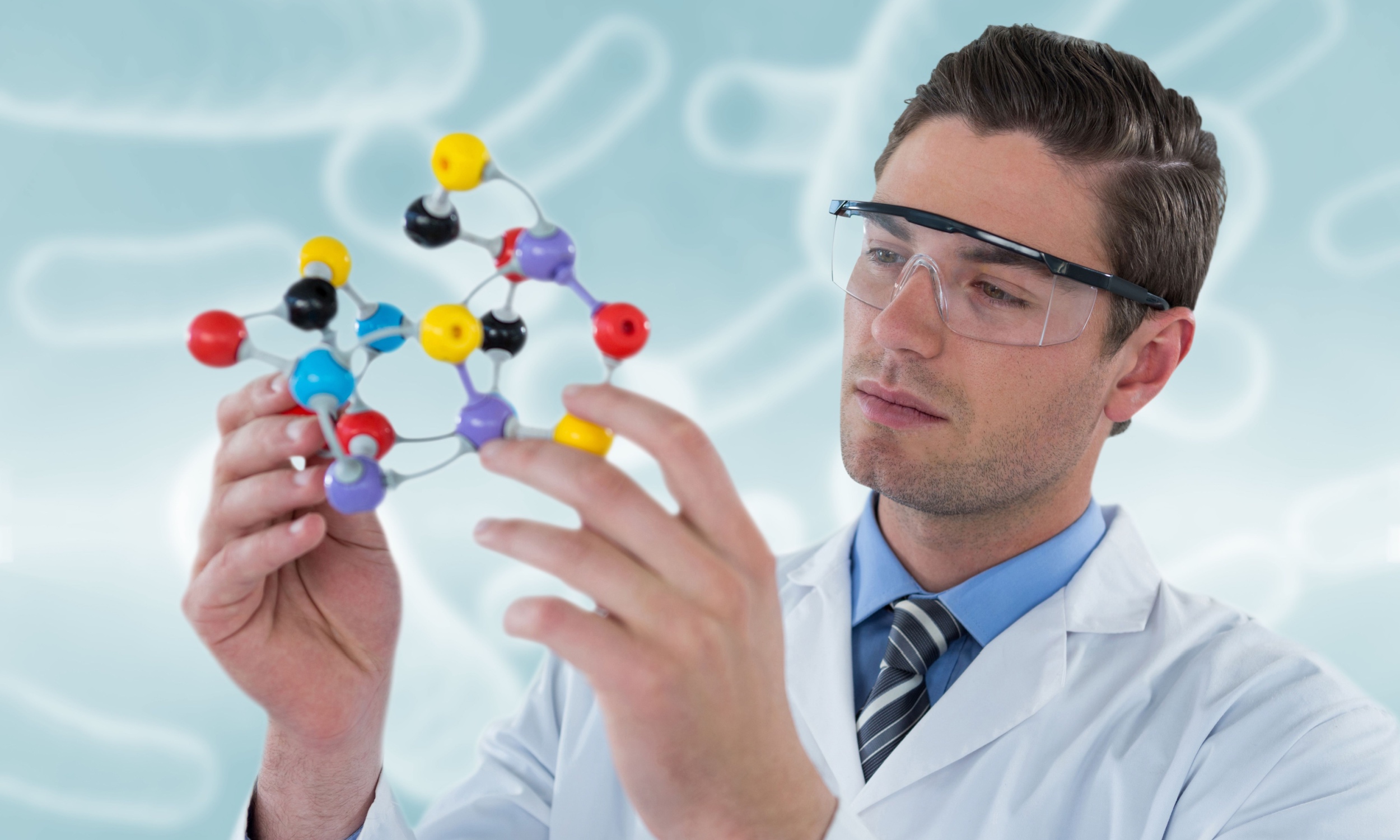 Scientist analyzing molecular structures with AI software, representing Health AI jobs in drug discovery.
